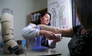 Lymphadema nurse with patient. (Photo by Paul Daly)